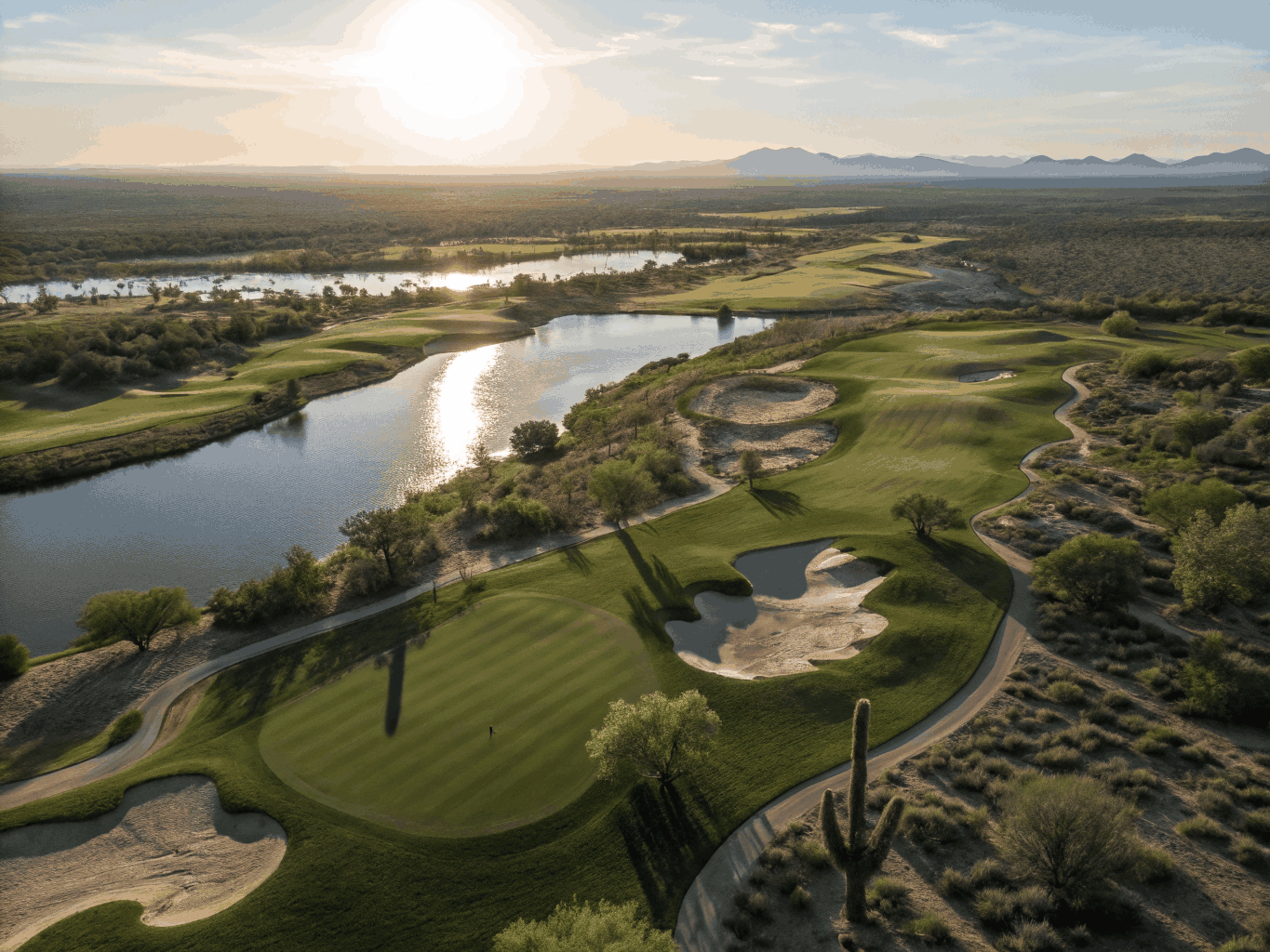 Cinematic drone view of a luxury Arizona golf course at sunset